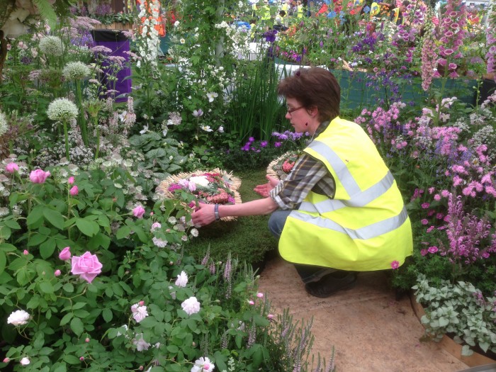 Sarah Horne placing cushions with Debbie Cooke